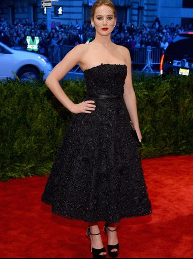 Jennifer Lawrence is the epitome of dramatic glamour in a Christian Dior dress and Brian Atwood heels.